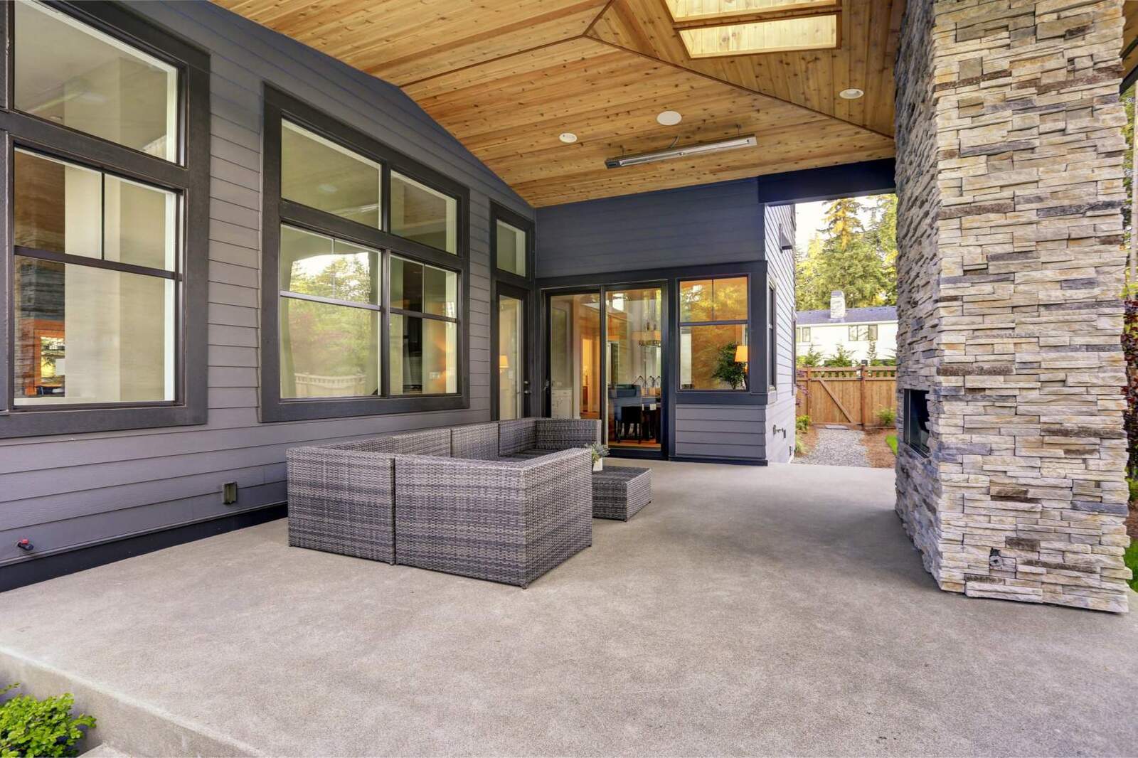 cement patio with outdoor fireplace