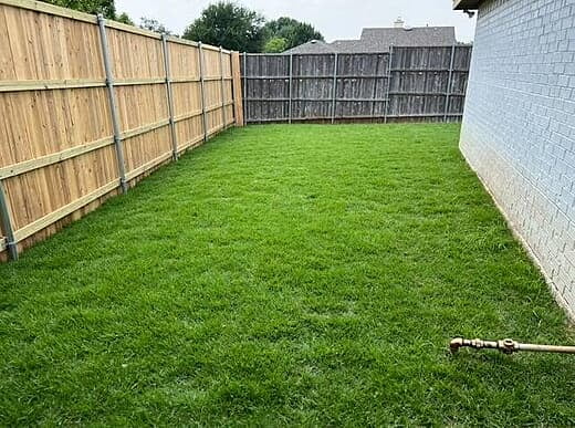 New Wooden Fence and Fresh Sod Installation